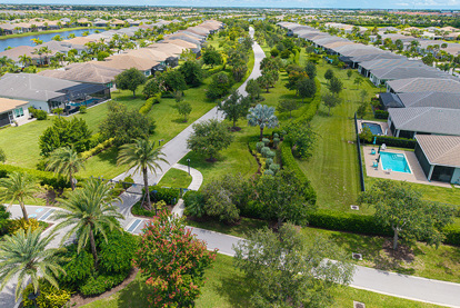 Aerial view of a walking and golf cart path in a GL Homes community, highlighting green space and thoughtful planning.
