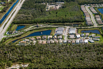 Aerial view of the Valencia Trails community in Naples, Florida, featuring green buffers and a thoughtfully planned layout that supports livable, sustainable design.